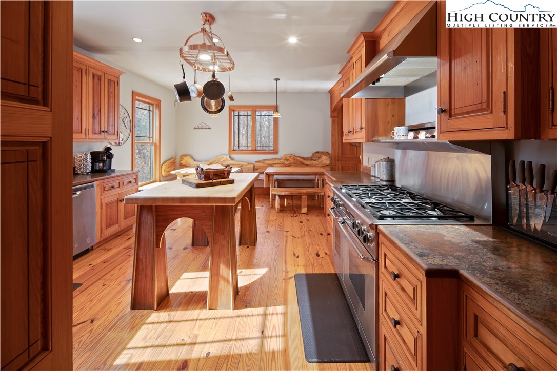 442 Aldridge Road Banner Elk, NC 28604 - Photo 8 of 50 a kitchen with stainless steel appliances granite countertop a stove a sink and a microwave