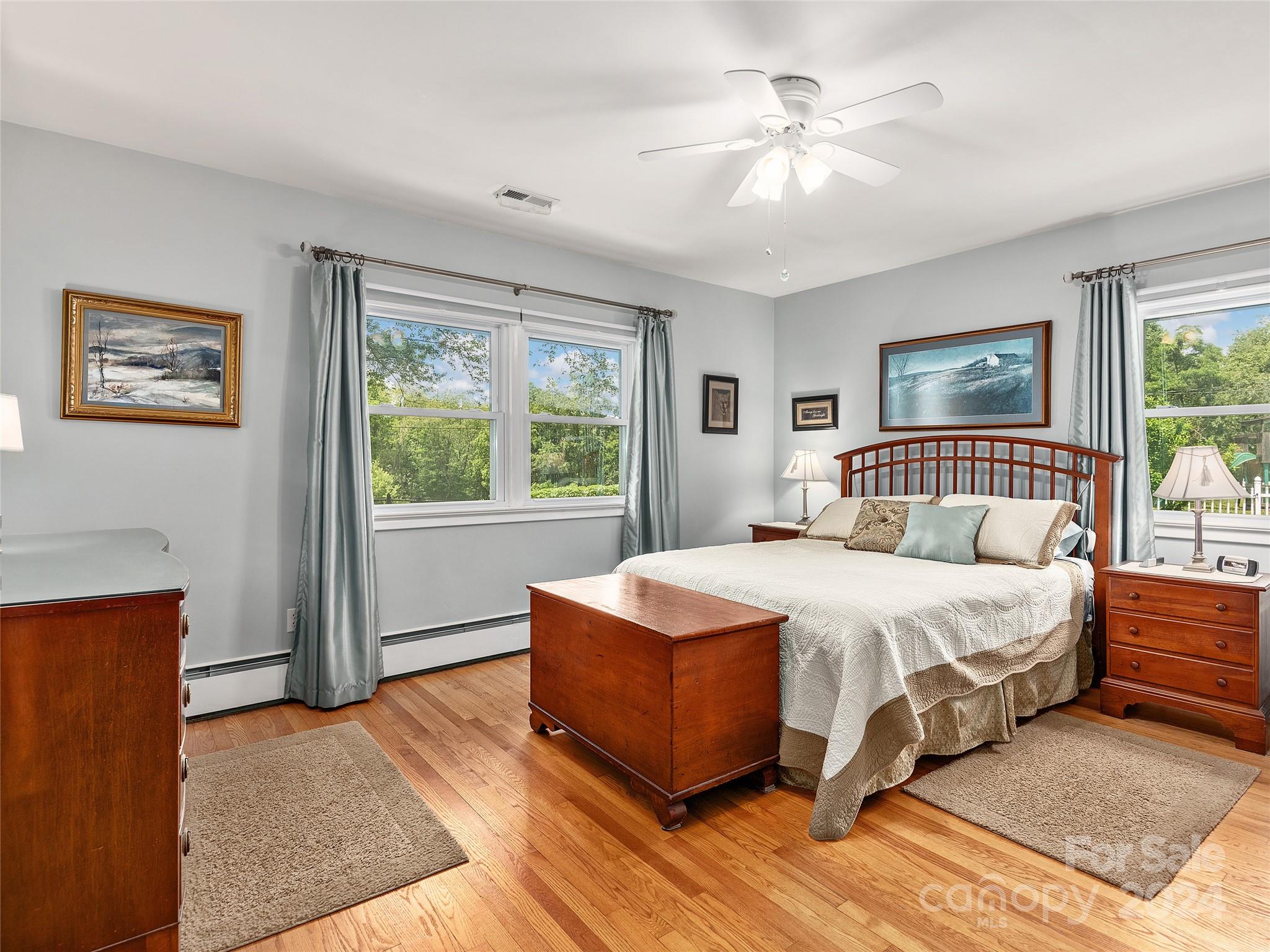 175 Rogers Street Clyde, NC 28721 - Photo 13 of 35 a bedroom with a large bed and a window