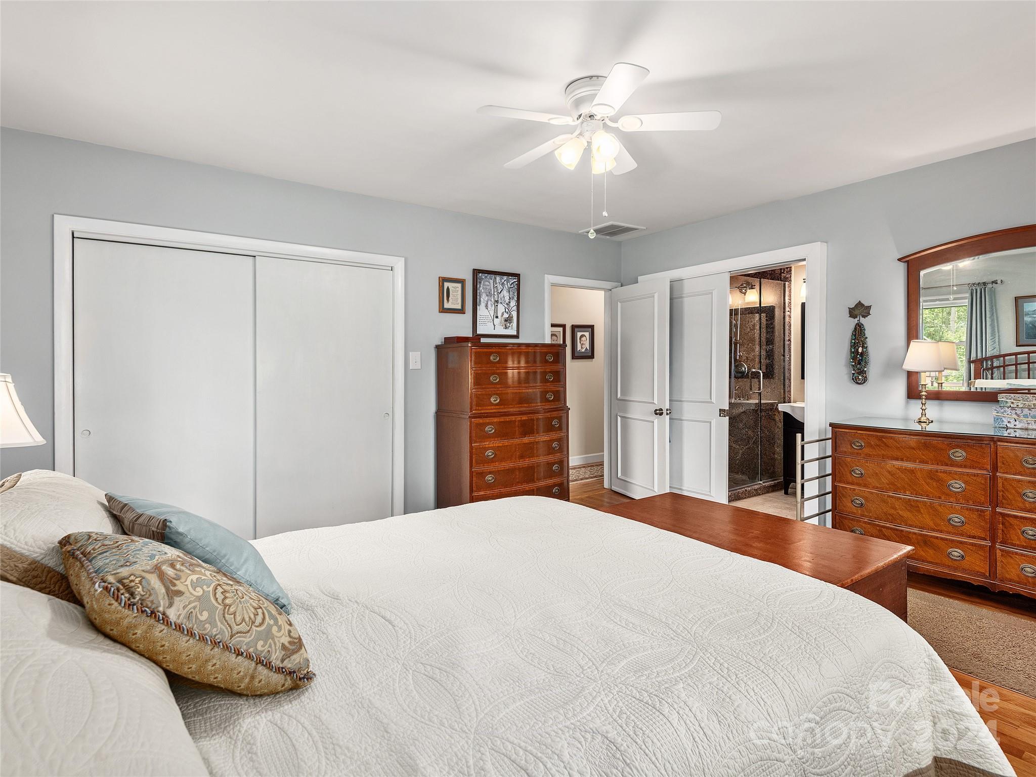 175 Rogers Street Clyde, NC 28721 - Photo 14 of 35 a bedroom with a large bed and closet