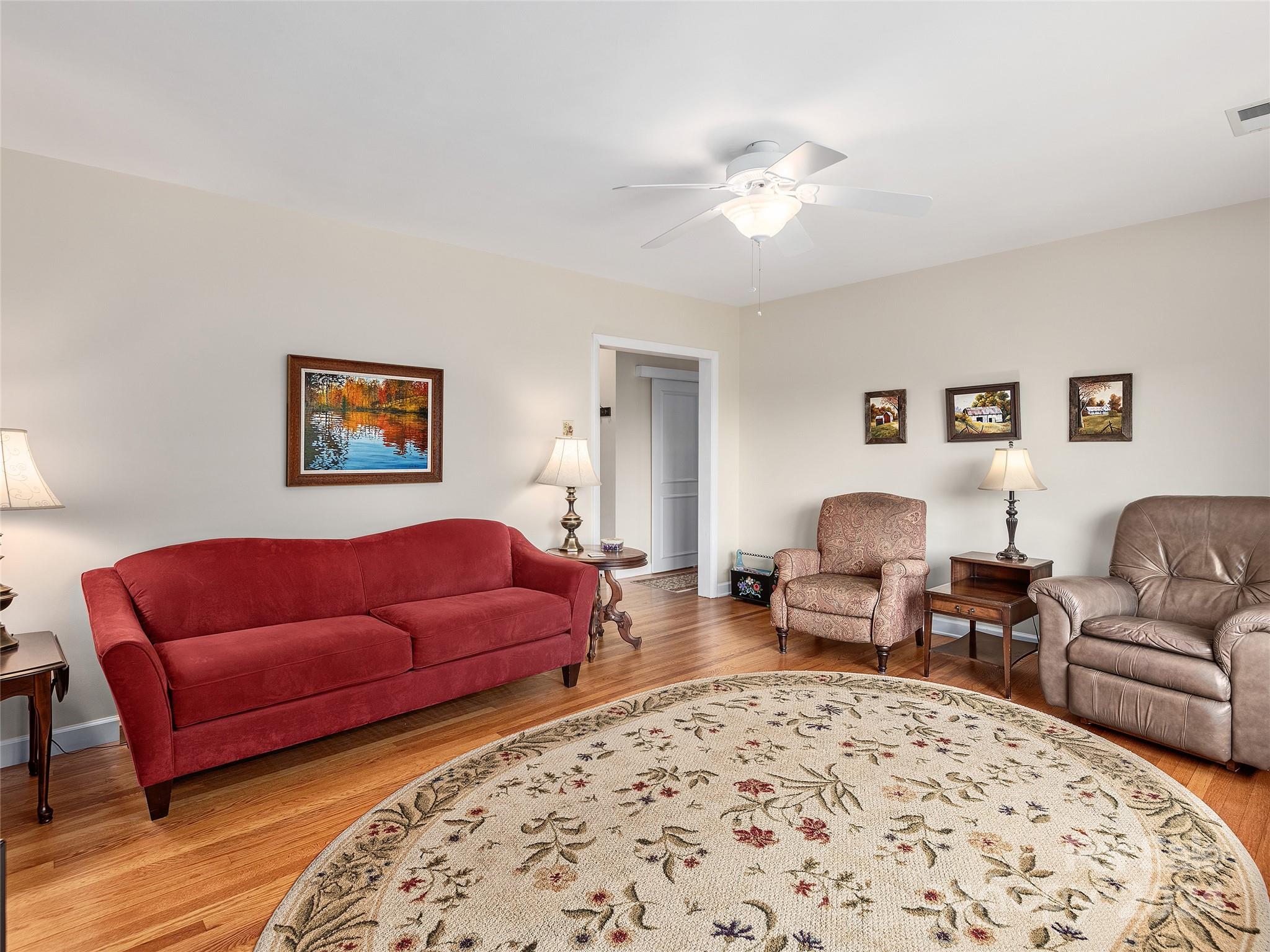 175 Rogers Street Clyde, NC 28721 - Photo 5 of 35 a living room with furniture and a couch