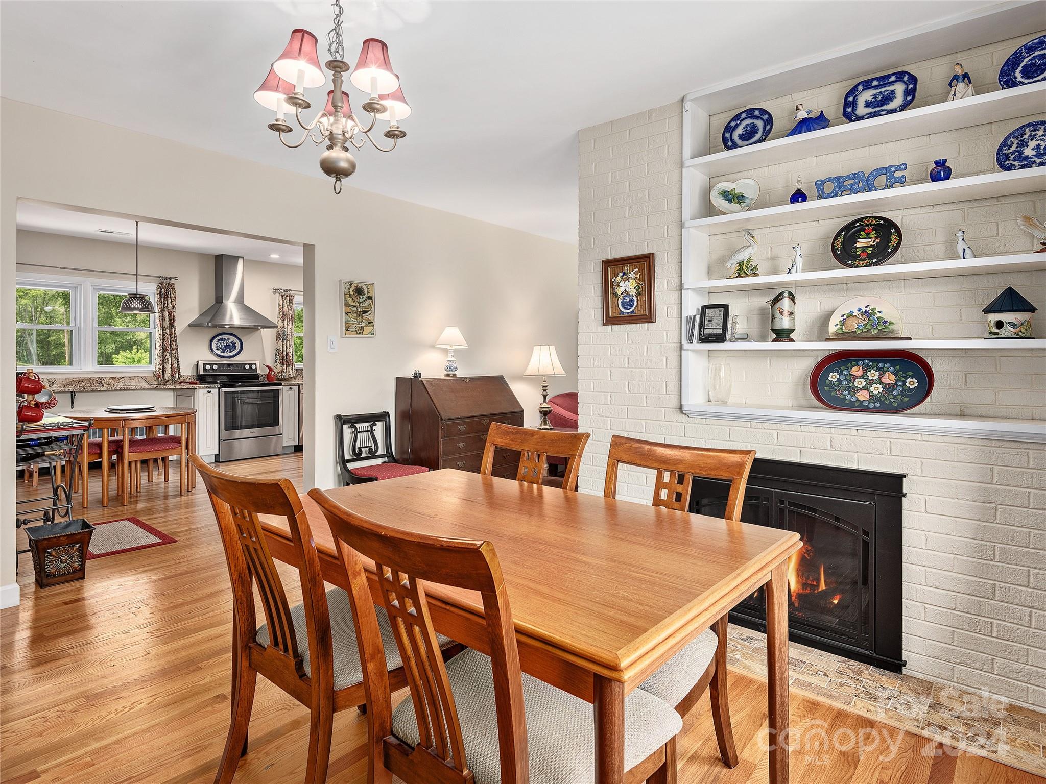 175 Rogers Street Clyde, NC 28721 - Photo 6 of 35 a view of a dining room with furniture and wooden floor