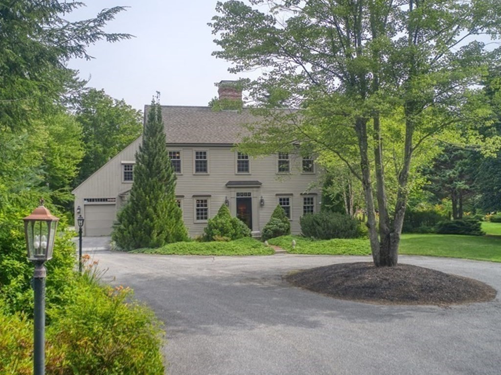 916 Chase Road Lunenburg, MA 01462 - Photo 1 of 42 a front view of a house with a yard