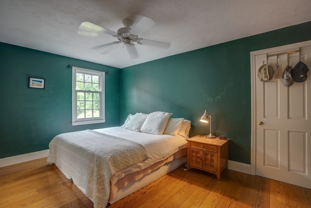 916 Chase Road Lunenburg, MA 01462 - Photo 32 of 42 a bedroom with a bed and a window