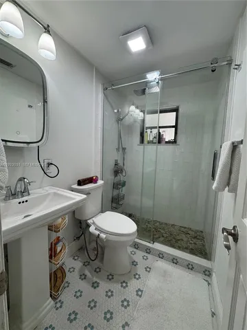 a view of a livingroom with workspace and a window