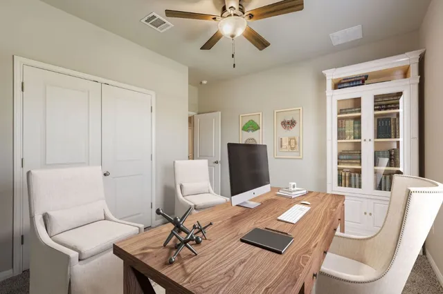 a workspace with furniture and window