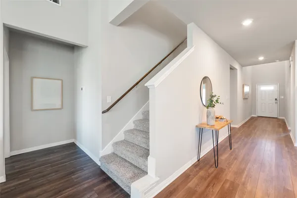 a front view of a house with plants