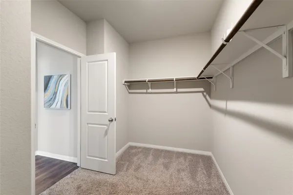 a front view of a house with a garden and plants