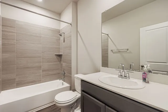 a bathroom with a sink a toilet and a bathtub