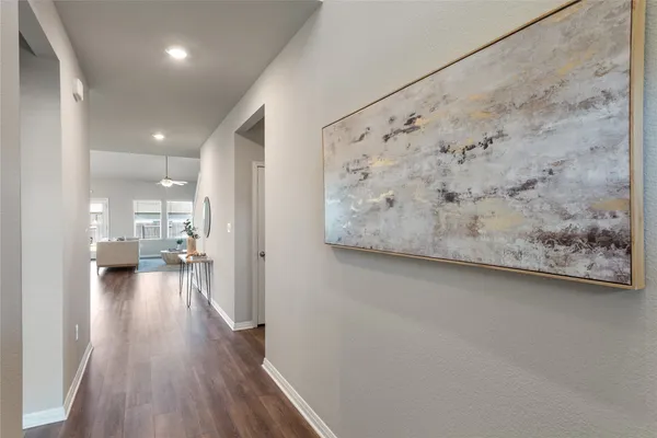 a living room with fireplace furniture and a large window