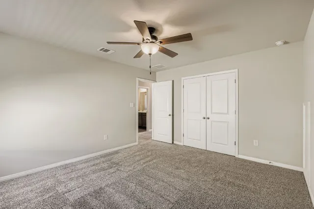 a view of a chandelier fan in a room