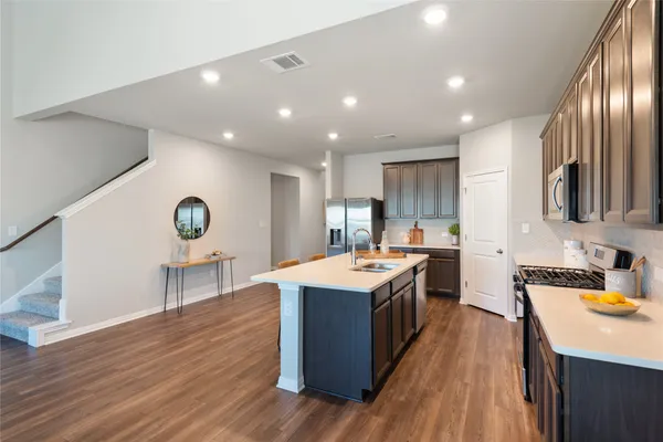 a bedroom with bed and a chandelier