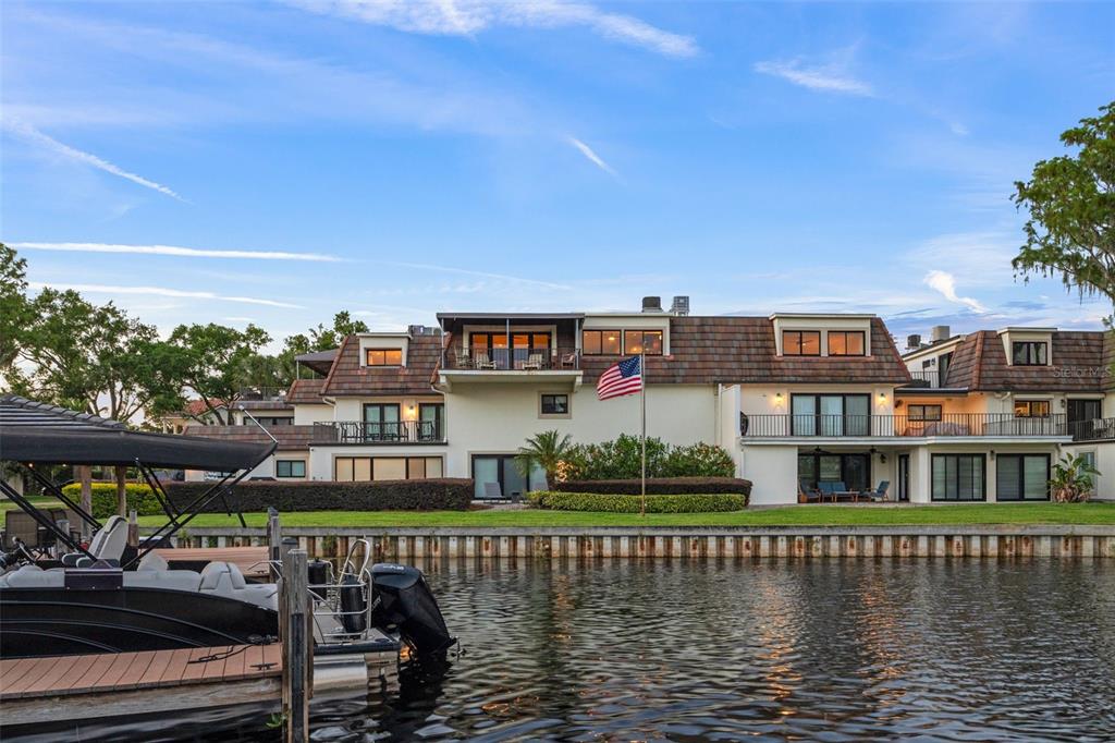 a view of houses with an ocean from a lake view