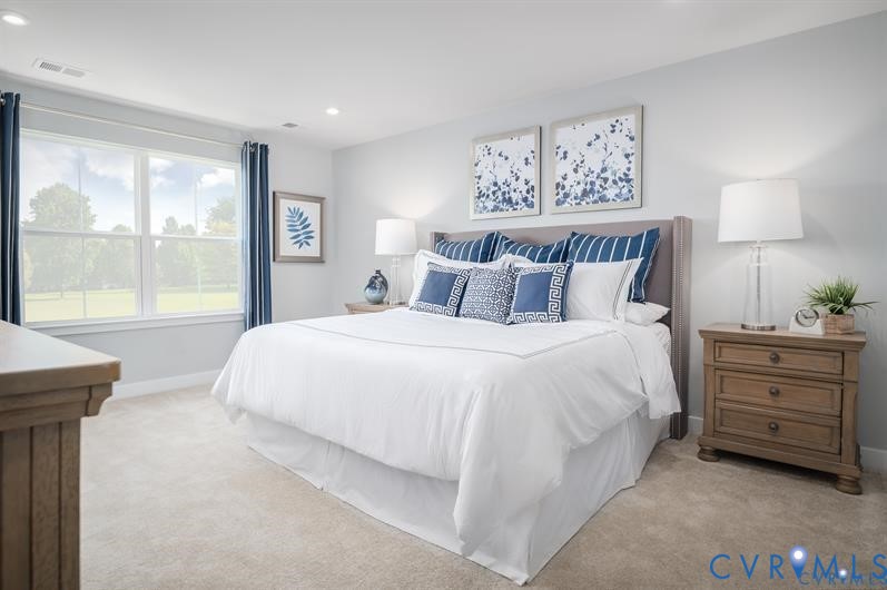 2132 Old Lime Road Sandston, VA 23150 - Photo 4 of 9 a bedroom with a bed and a night stand