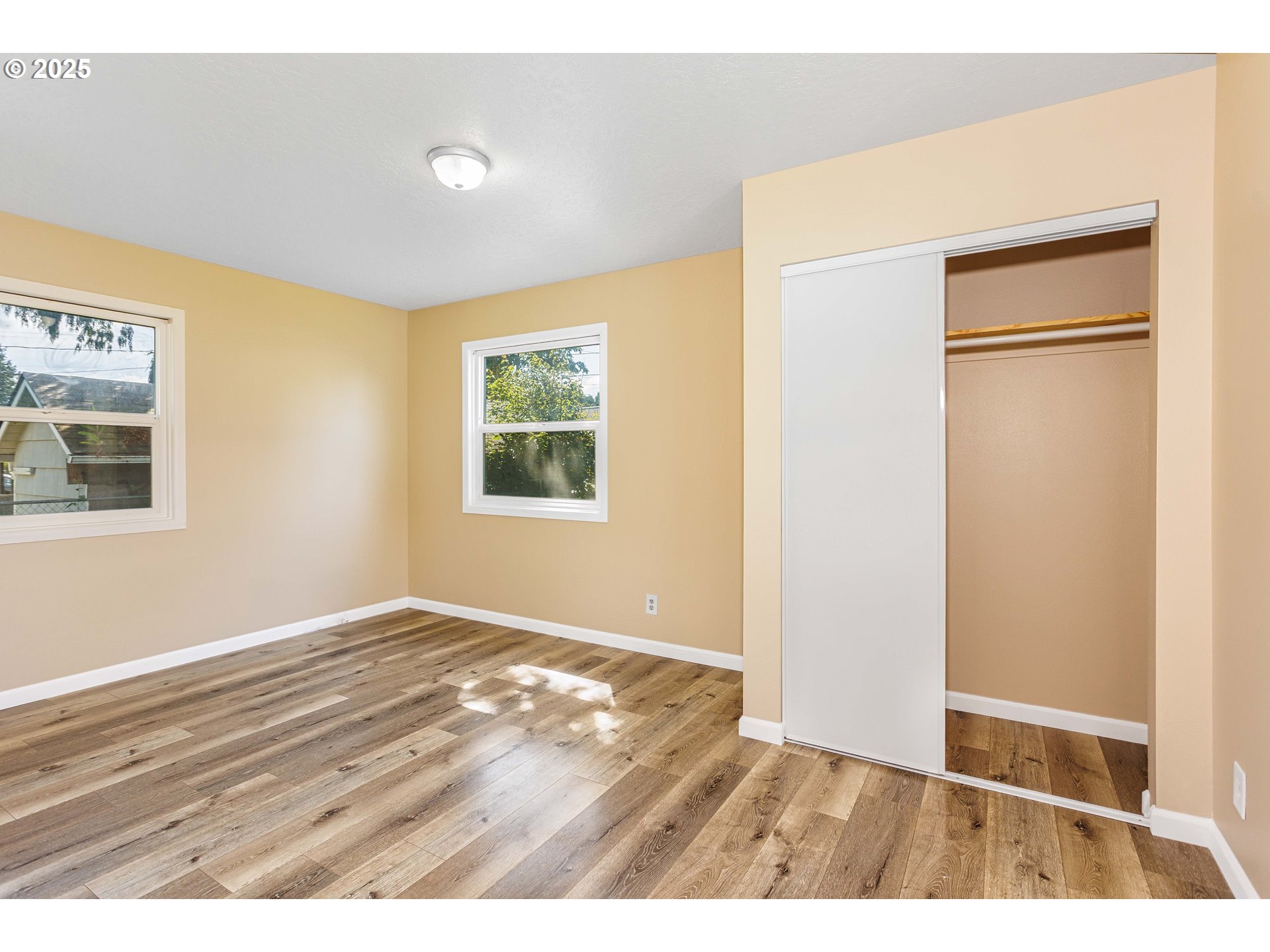1617 7th Avenue Longview, WA 98632 - Photo 13 of 23 a view of an empty room with wooden floor