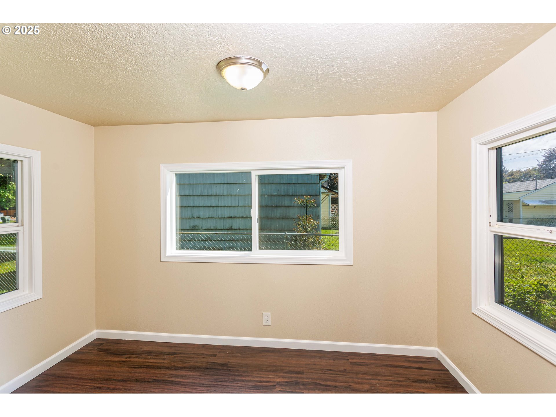 1617 7th Avenue Longview, WA 98632 - Photo 7 of 23 a view of an empty room with a window