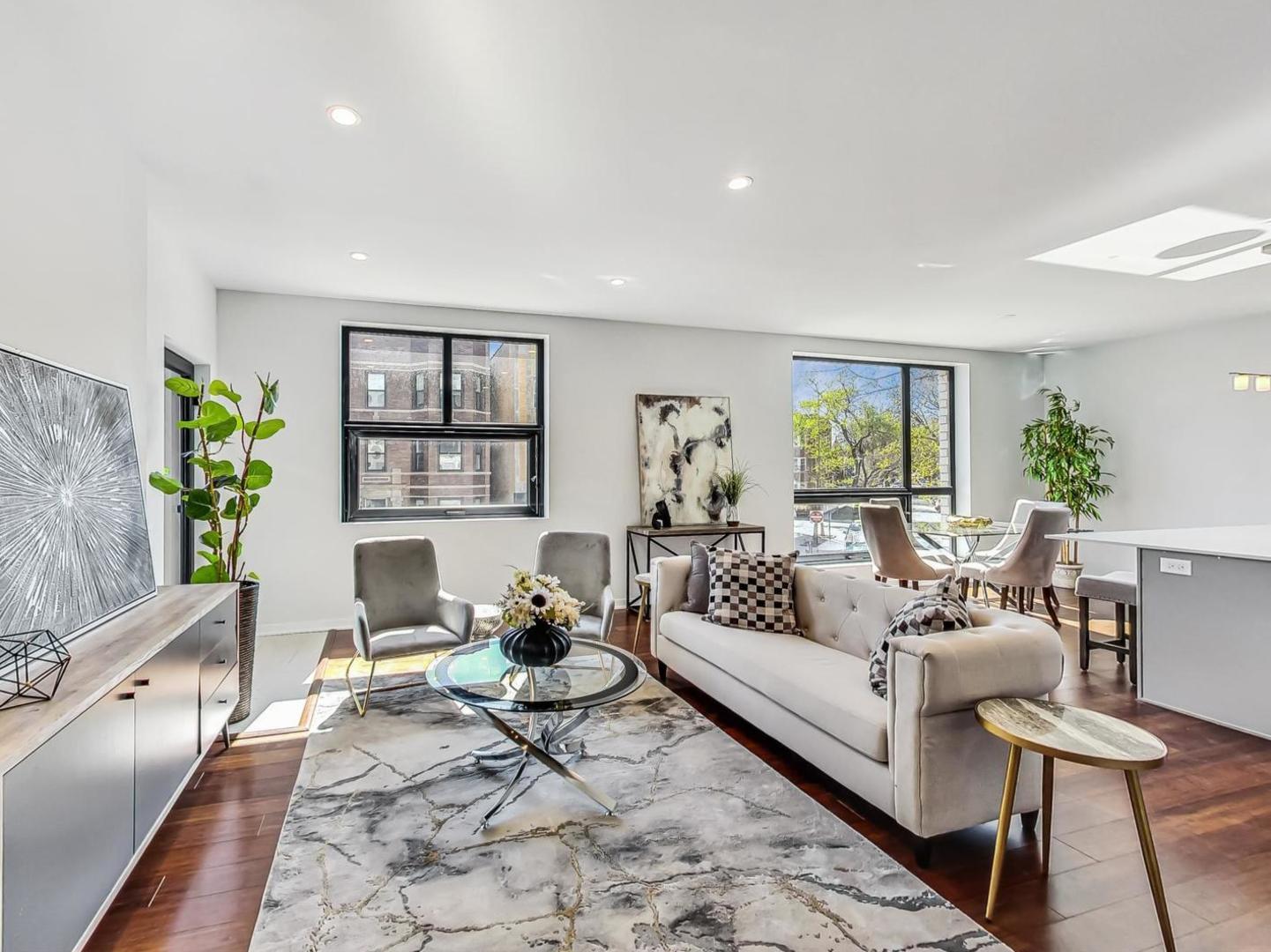 5691 North Ridge Avenue, Unit 201 Chicago, IL 60660 - Photo 12 of 31 a living room with furniture and a potted plant