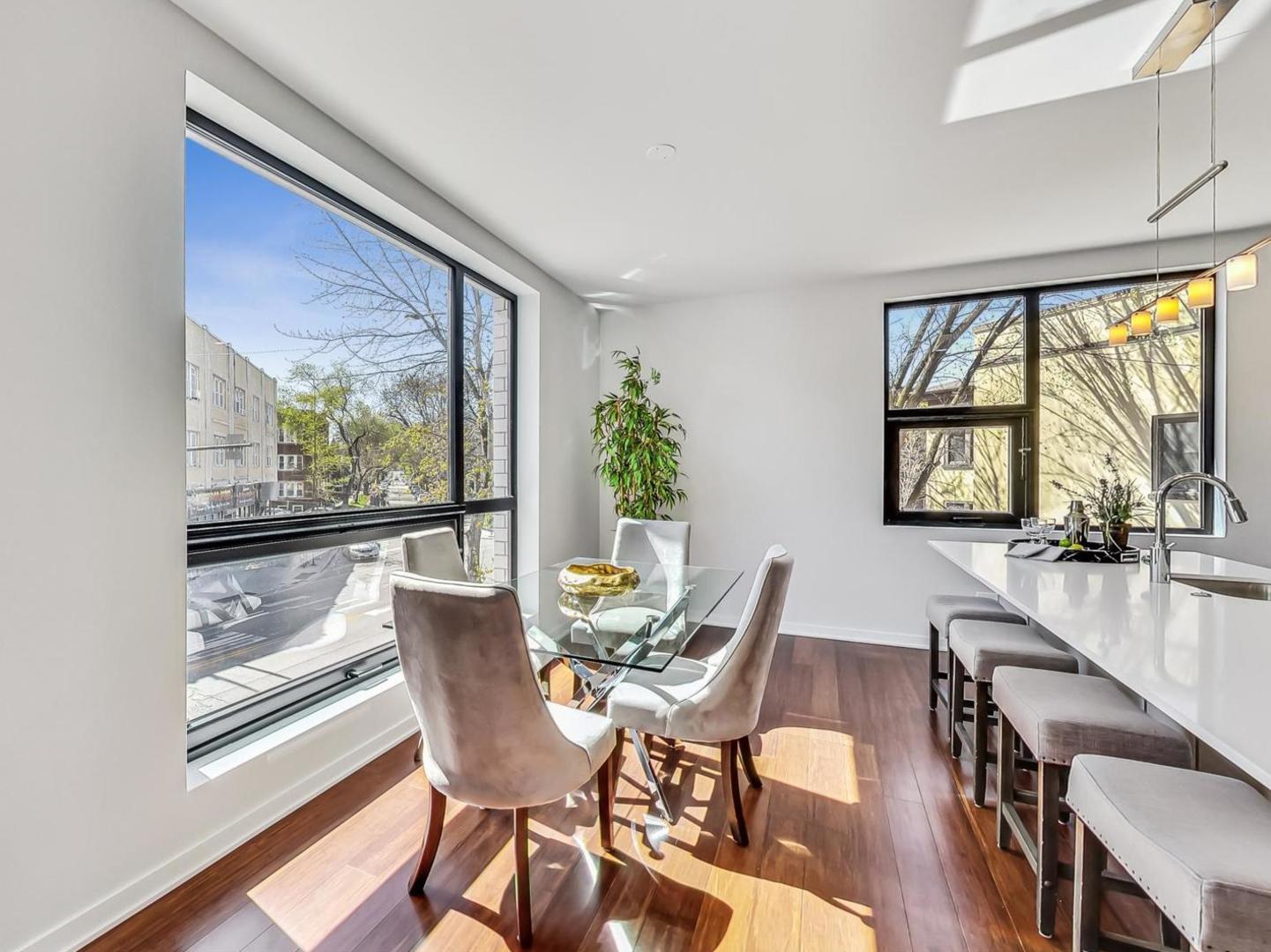 5691 North Ridge Avenue, Unit 201 Chicago, IL 60660 - Photo 14 of 31 a view of a dining room with furniture window and outside view