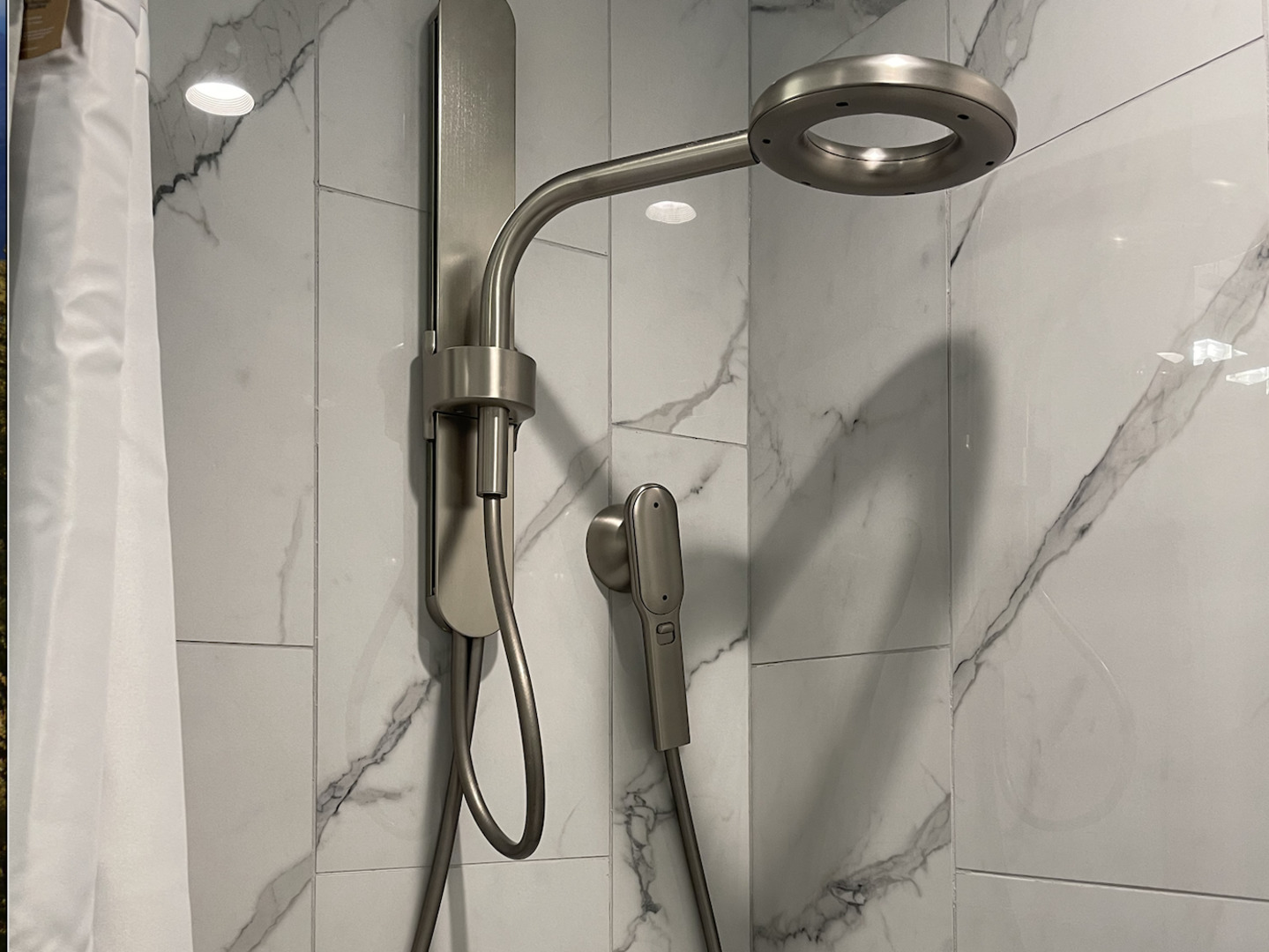 5691 North Ridge Avenue, Unit 201 Chicago, IL 60660 - Photo 19 of 31 a bathroom with a mirror and a shower