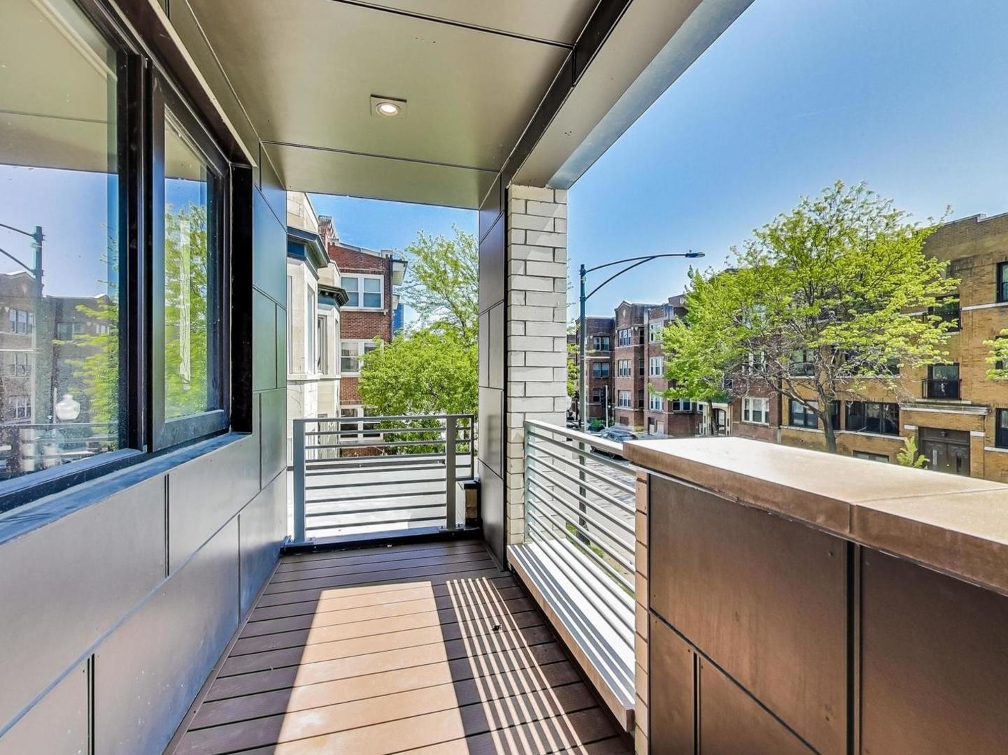 5691 North Ridge Avenue, Unit 201 Chicago, IL 60660 - Photo 28 of 31 a view of a building from a balcony