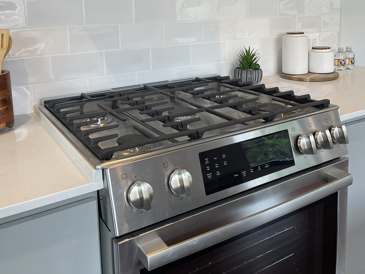 5691 North Ridge Avenue, Unit 201 Chicago, IL 60660 - Photo 8 of 31 a close up of a stove top oven sitting inside of a kitchen