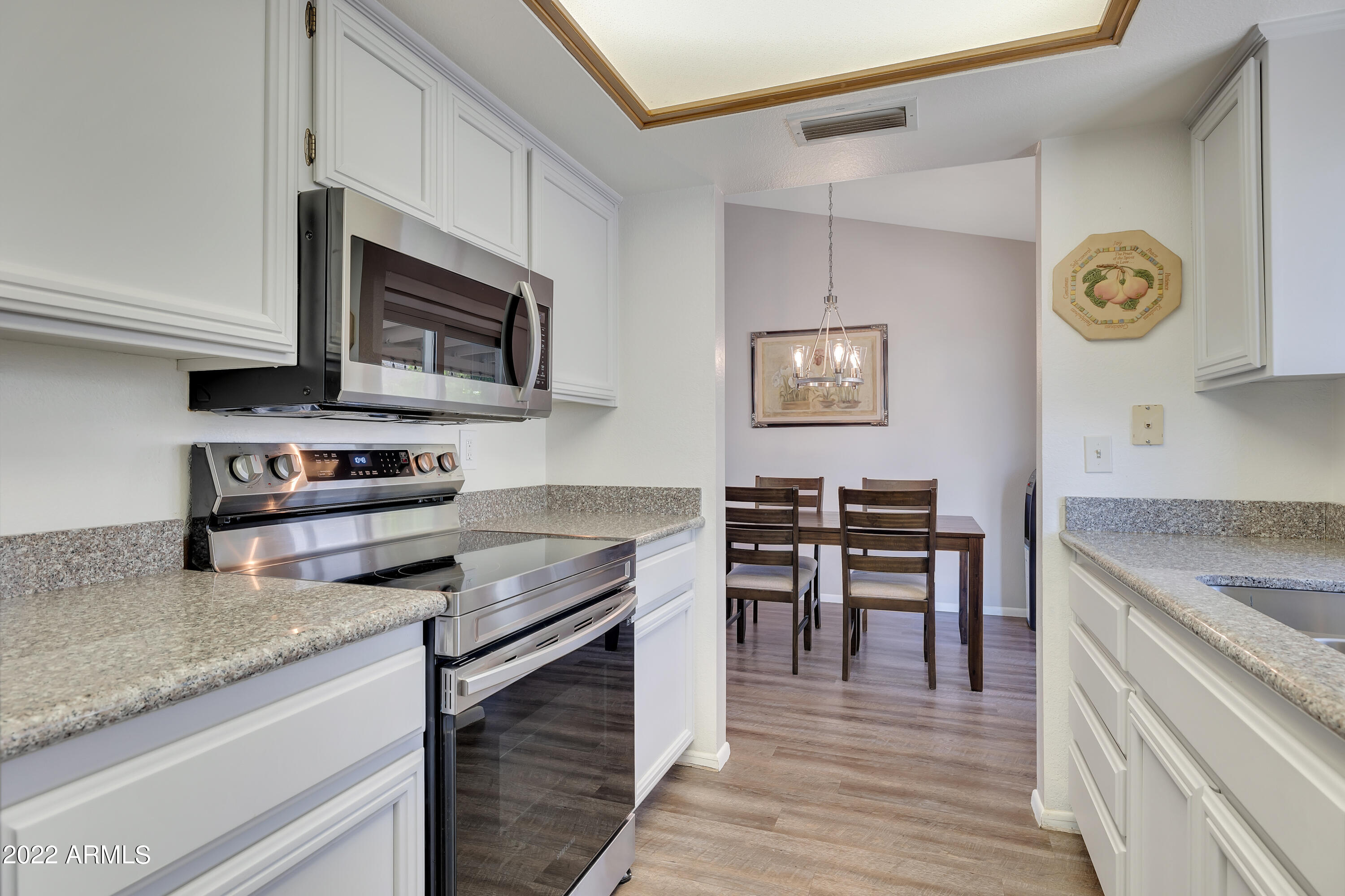 1101 East Wagoner Road Phoenix, AZ 85022 - Photo 10 of 25 Kitchen with view to the diningroom