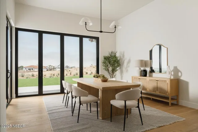 a view of a dining room with furniture window and outside view