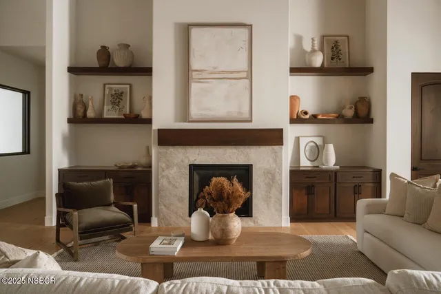 a living room with furniture and a fireplace