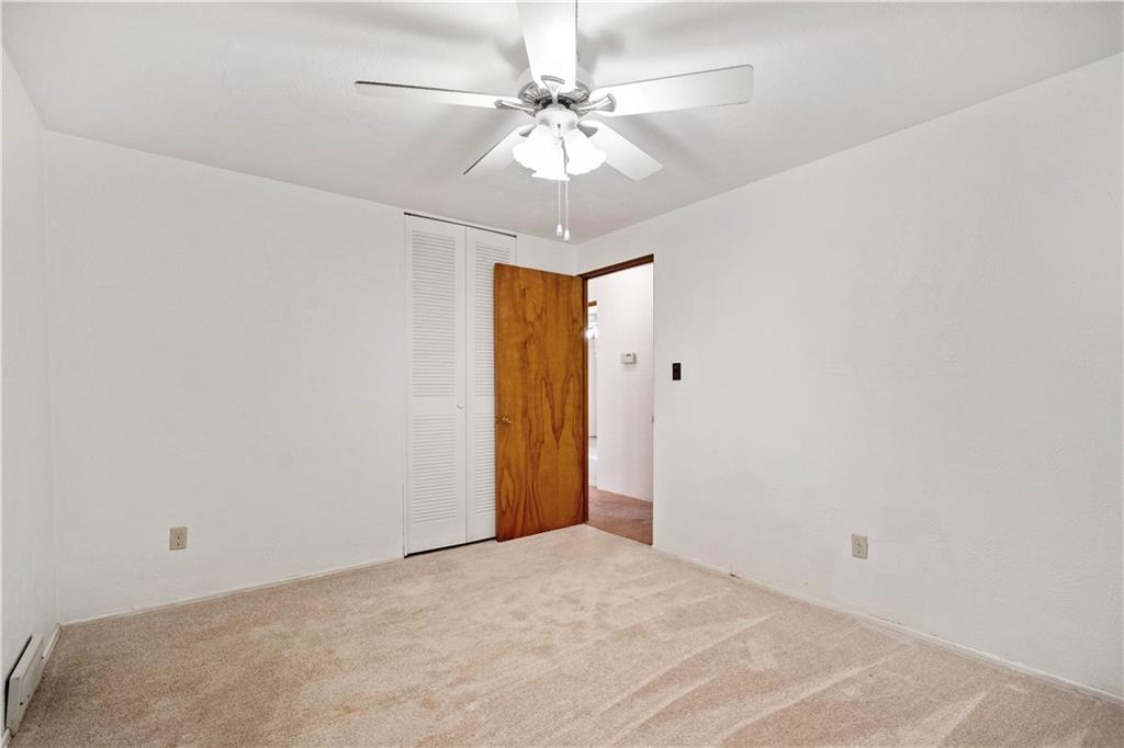 106 Fenway Road Pittsburgh, PA 15209 - Photo 17 of 25 a view of a room with a chandelier fan and a window