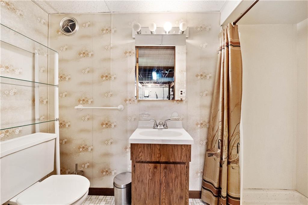 106 Fenway Road Pittsburgh, PA 15209 - Photo 19 of 25 a bathroom with a sink vanity mirror and toilet