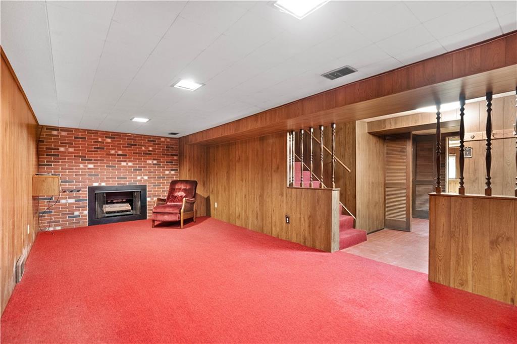 106 Fenway Road Pittsburgh, PA 15209 - Photo 20 of 25 an empty room with furniture and a fireplace