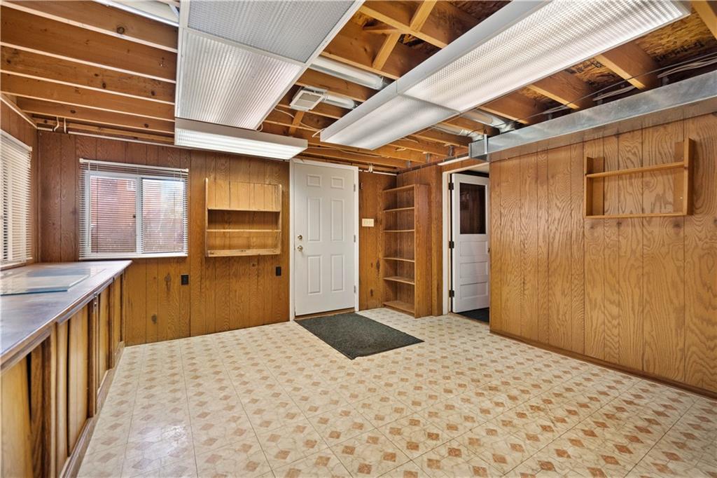 106 Fenway Road Pittsburgh, PA 15209 - Photo 22 of 25 a view of a hallway with wooden cabinets
