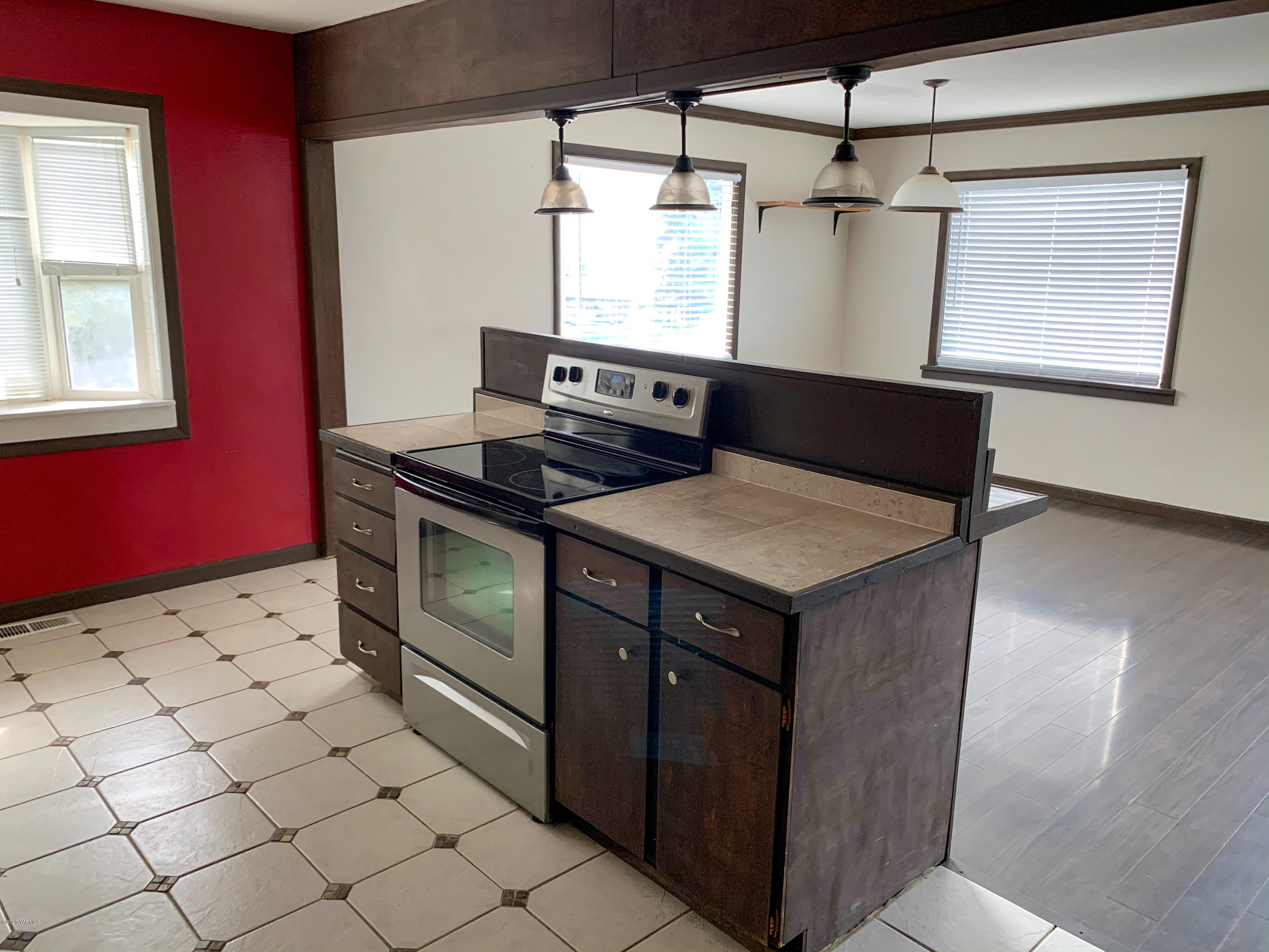 803 Speyers Road Selah, WA 98942 - Photo 15 of 38 a kitchen with stainless steel appliances granite countertop a stove and a microwave