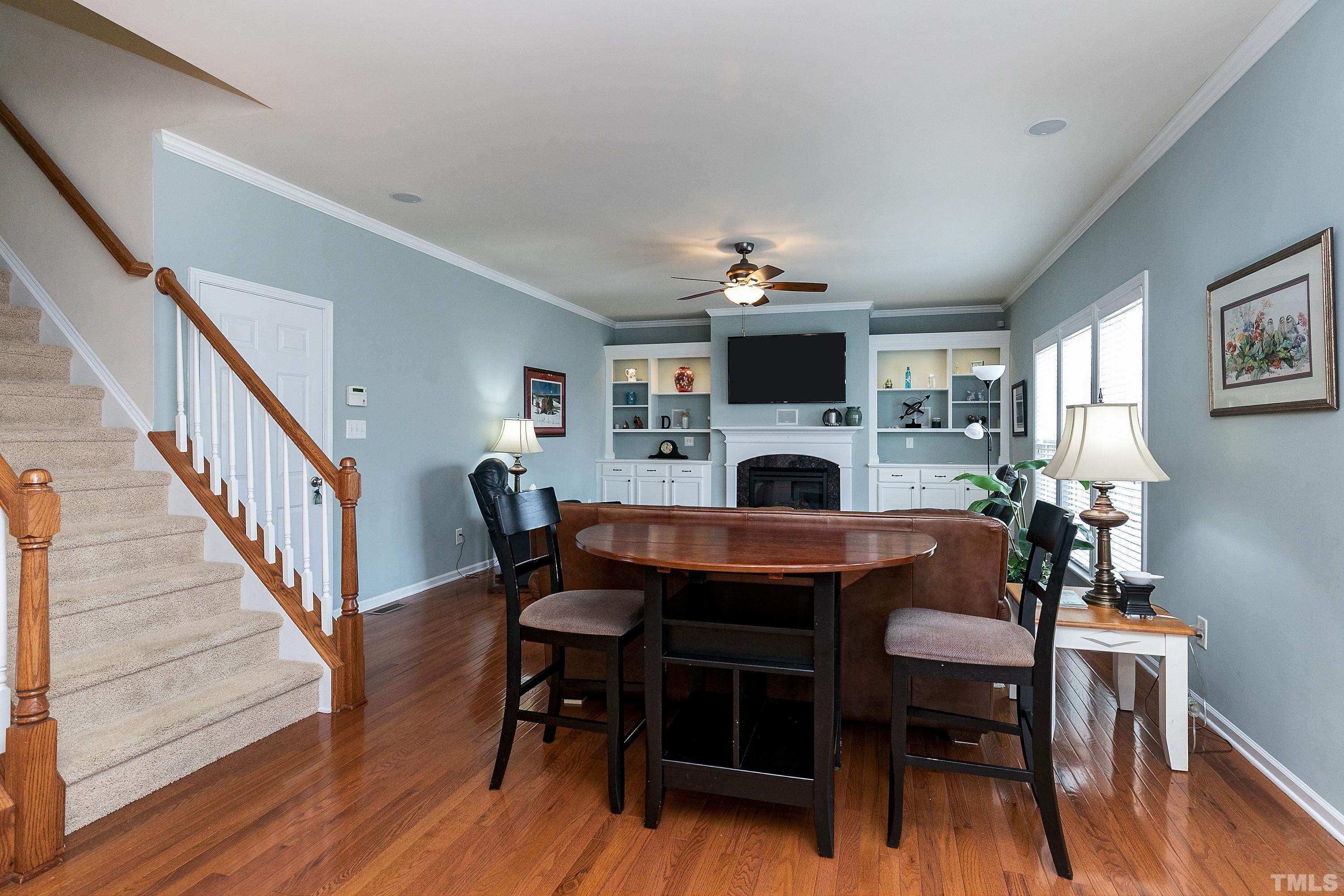 891 Seastone Street Raleigh, NC 27603 - Photo 11 of 51 a dining room with furniture and a fireplace