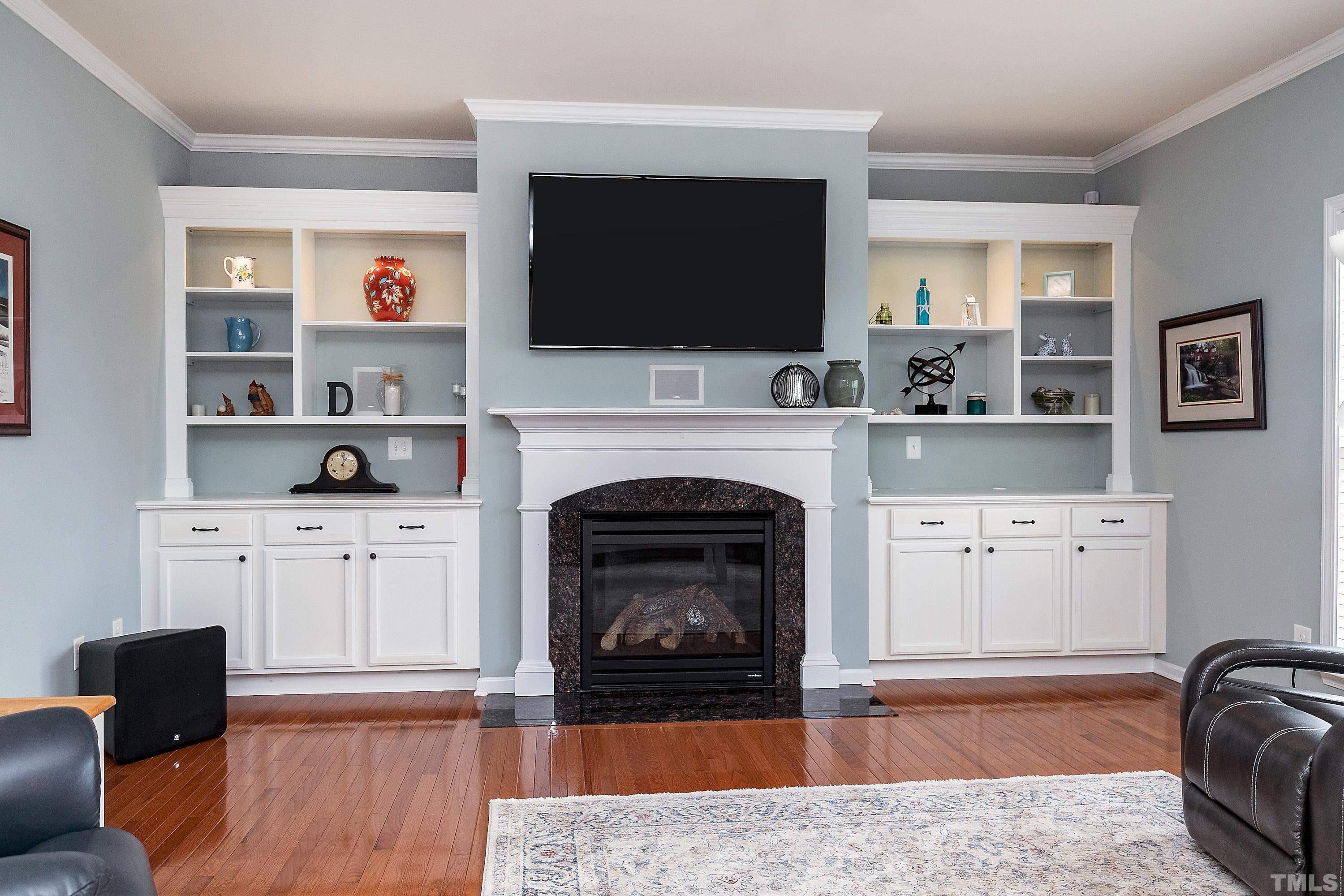 891 Seastone Street Raleigh, NC 27603 - Photo 14 of 51 a living room with furniture a flat screen tv and a fireplace