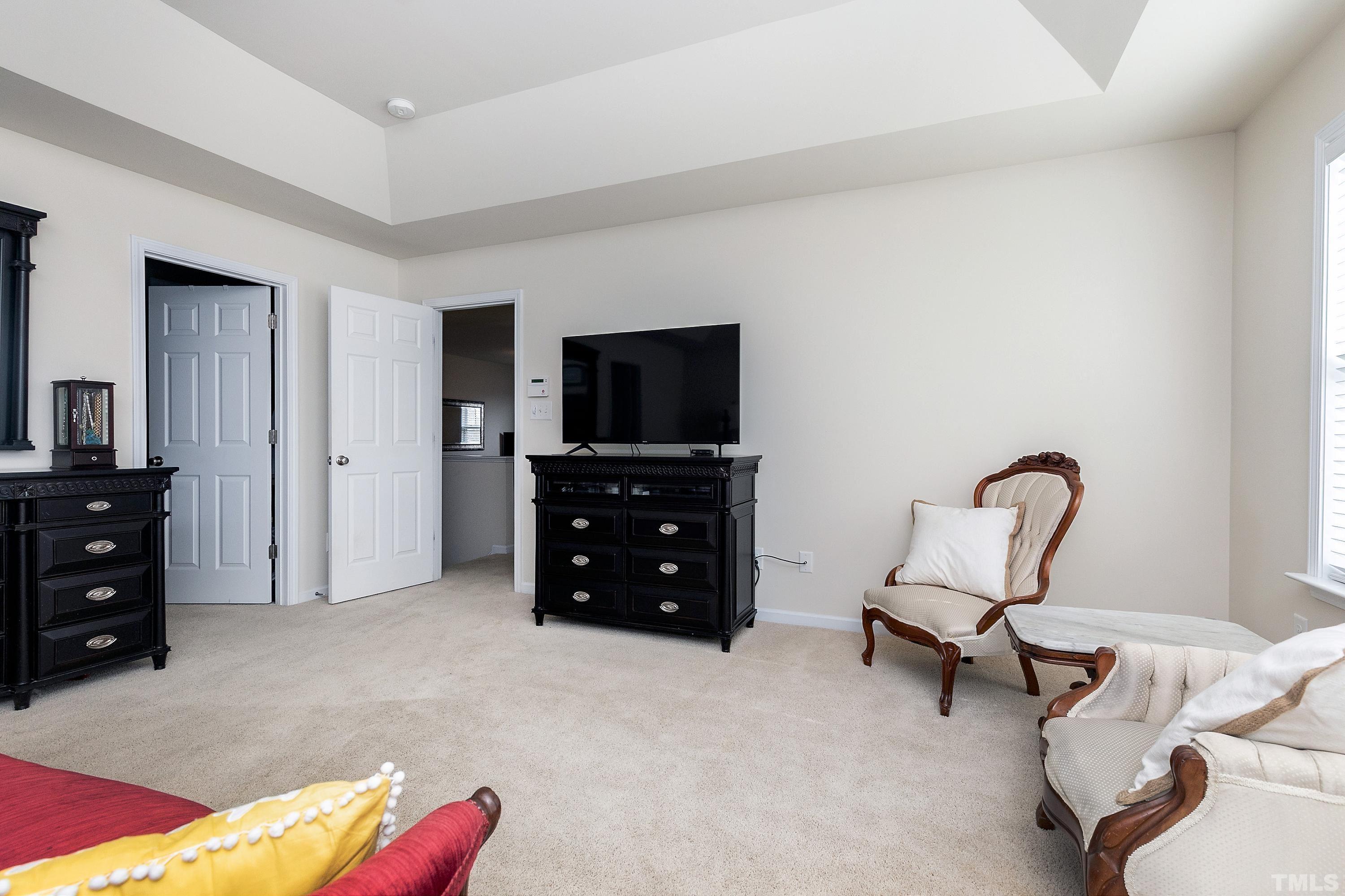 891 Seastone Street Raleigh, NC 27603 - Photo 20 of 51 a living room with furniture and a flat screen tv