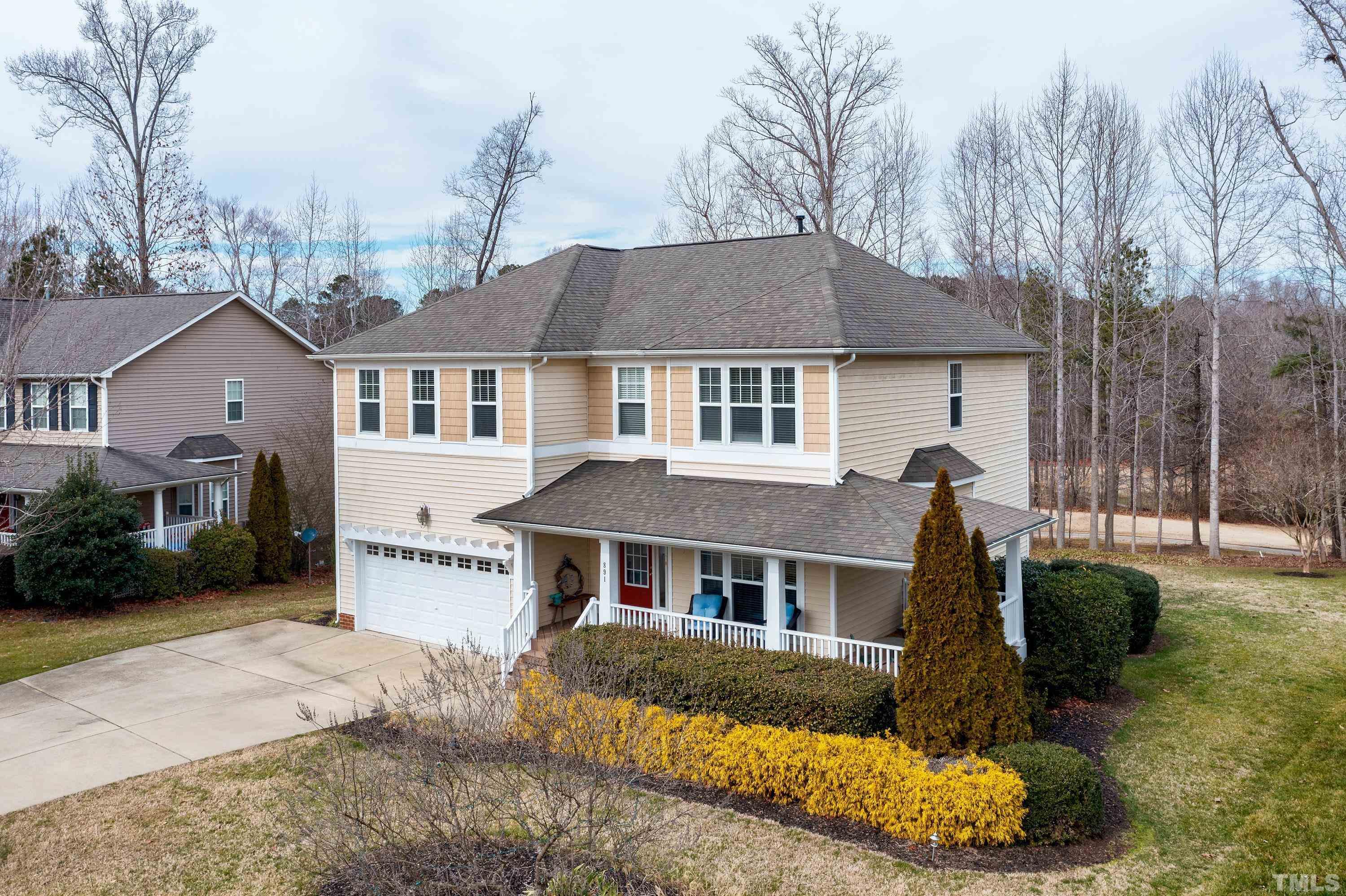 891 Seastone Street Raleigh, NC 27603 - Photo 38 of 51 a front view of a house with a yard