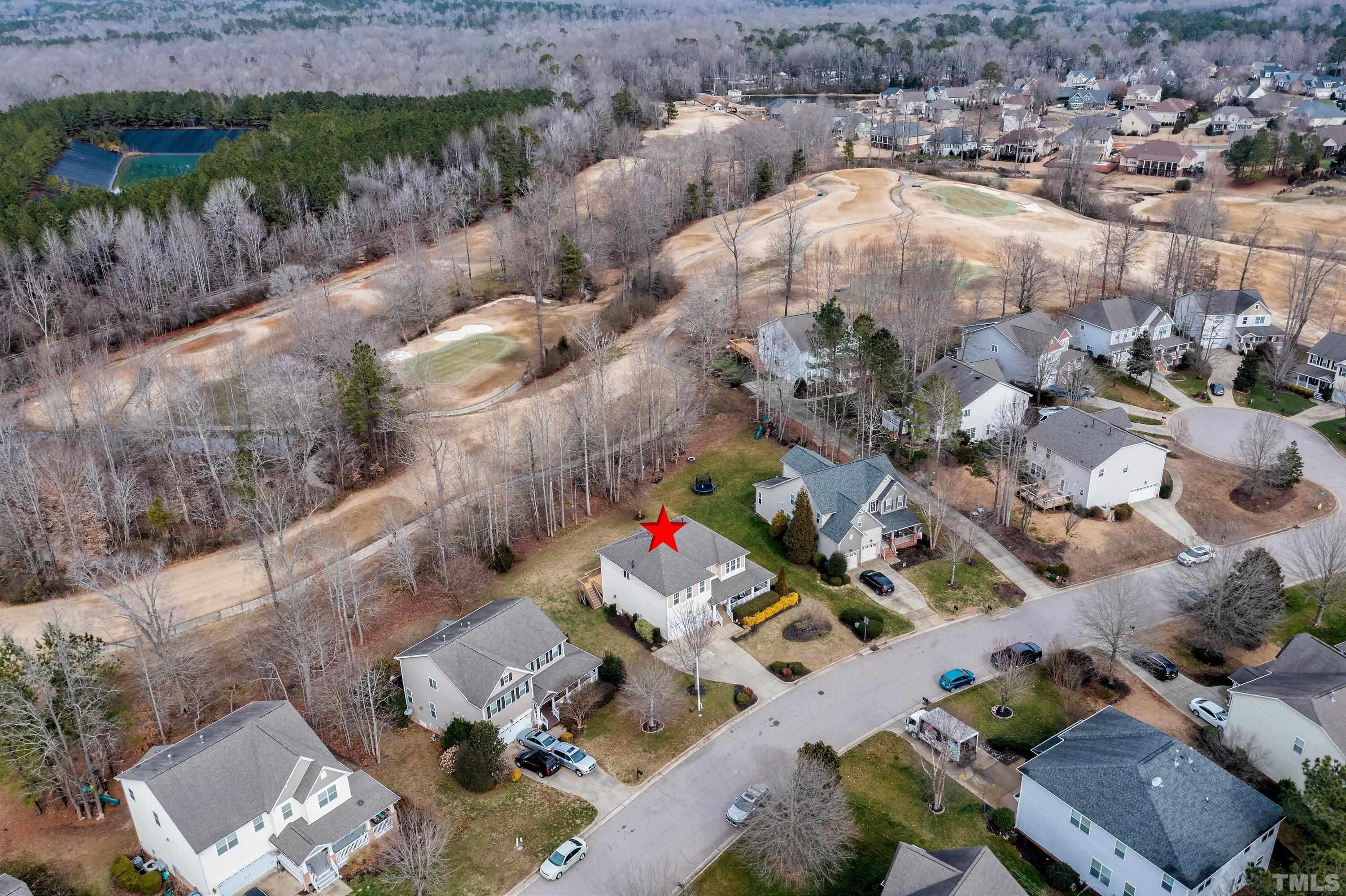 891 Seastone Street Raleigh, NC 27603 - Photo 46 of 51 an aerial view of a house with a yard