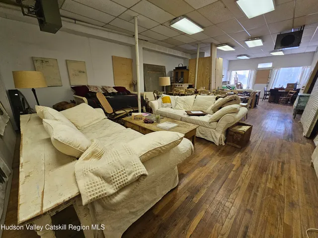 a room with furniture and a flat screen tv