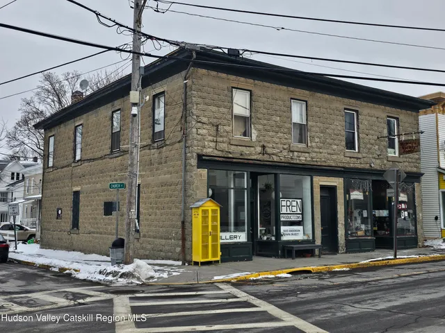a view of a brick building with large windows