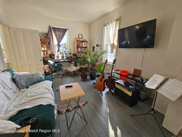 a kitchen with stainless steel appliances a stove a refrigerator and cabinets