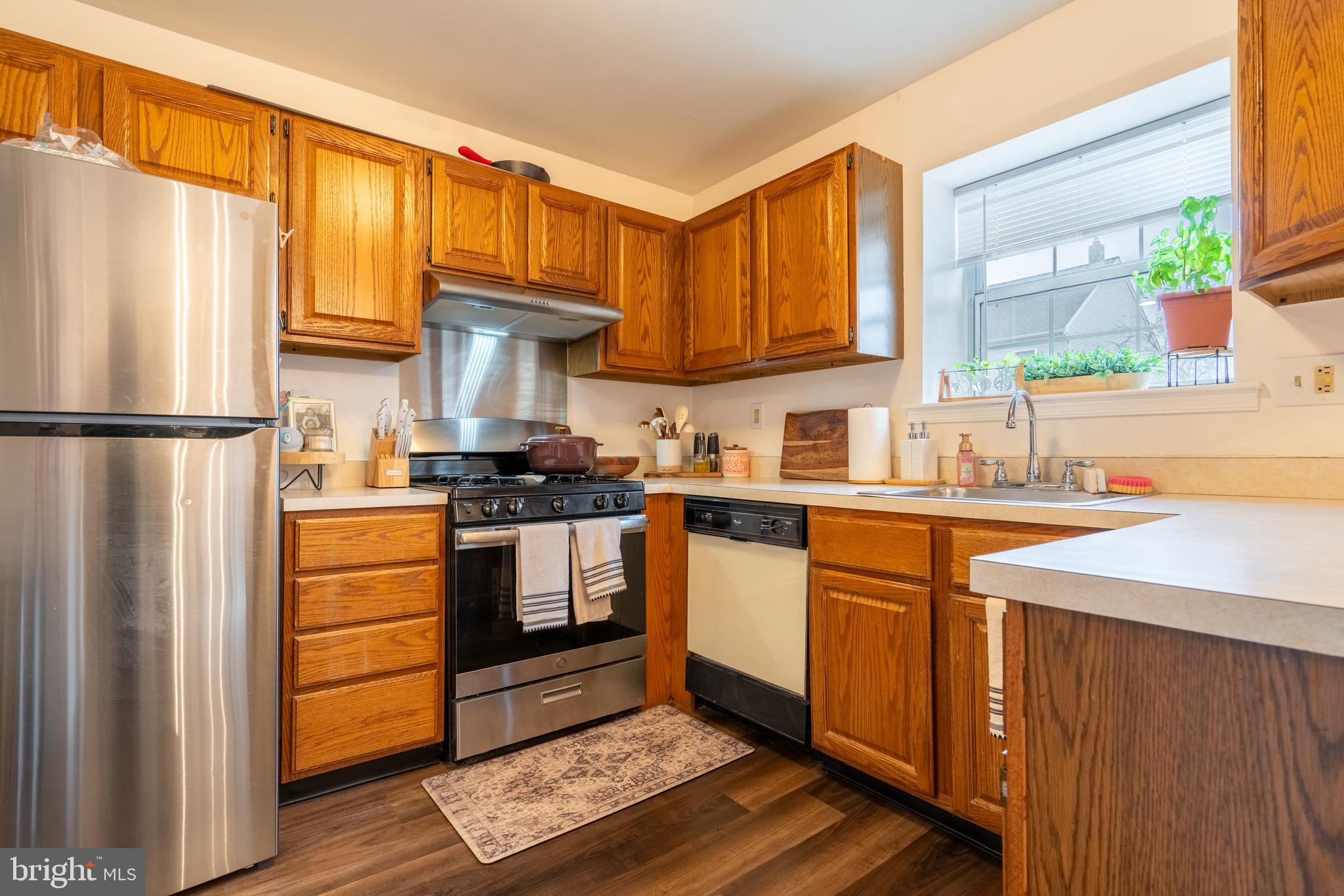 1410 Sentry Lane Eagleville, PA 19403 - Photo 13 of 32 a kitchen with a refrigerator stove and sink