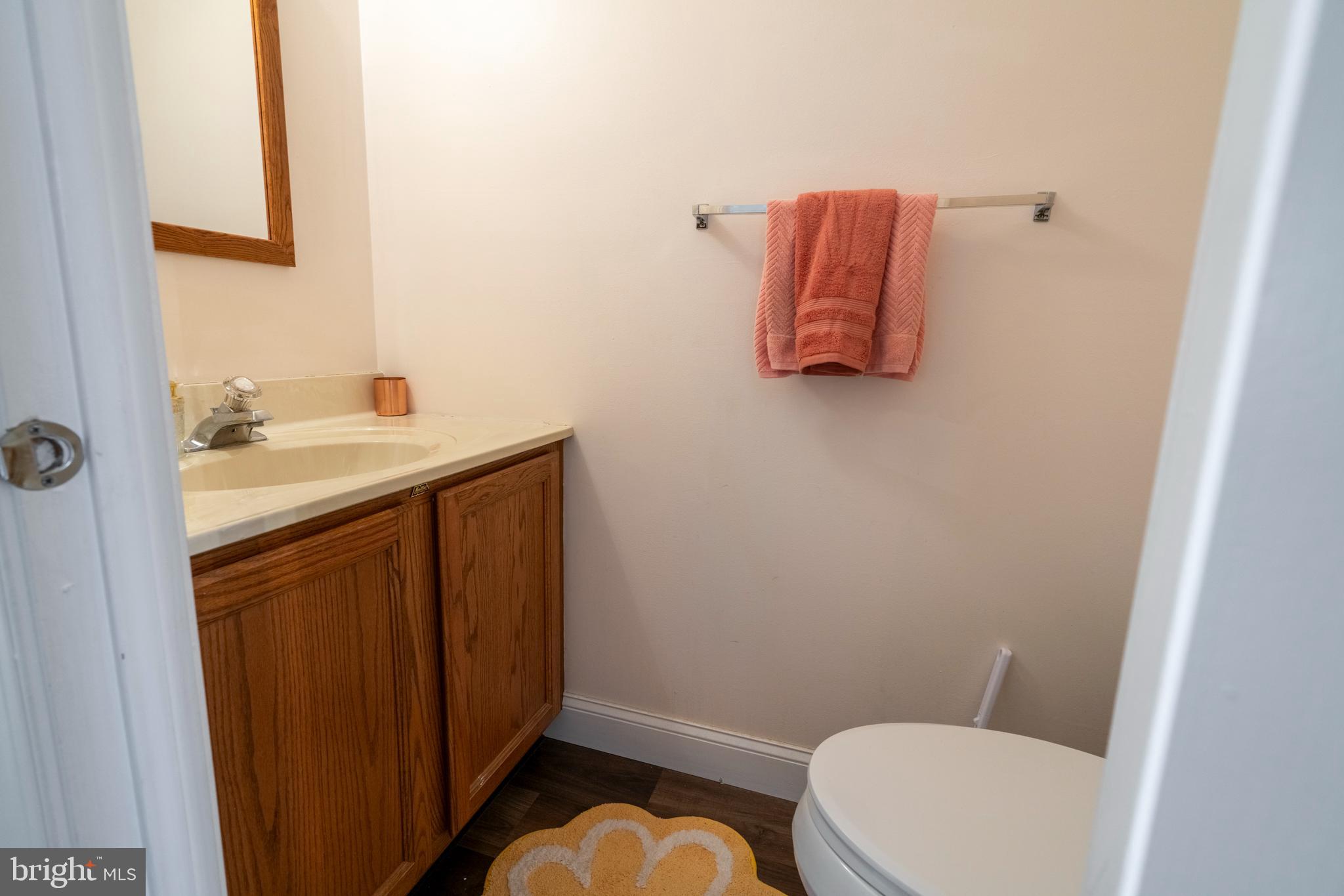 1410 Sentry Lane Eagleville, PA 19403 - Photo 15 of 32 a bathroom with a toilet sink and mirror