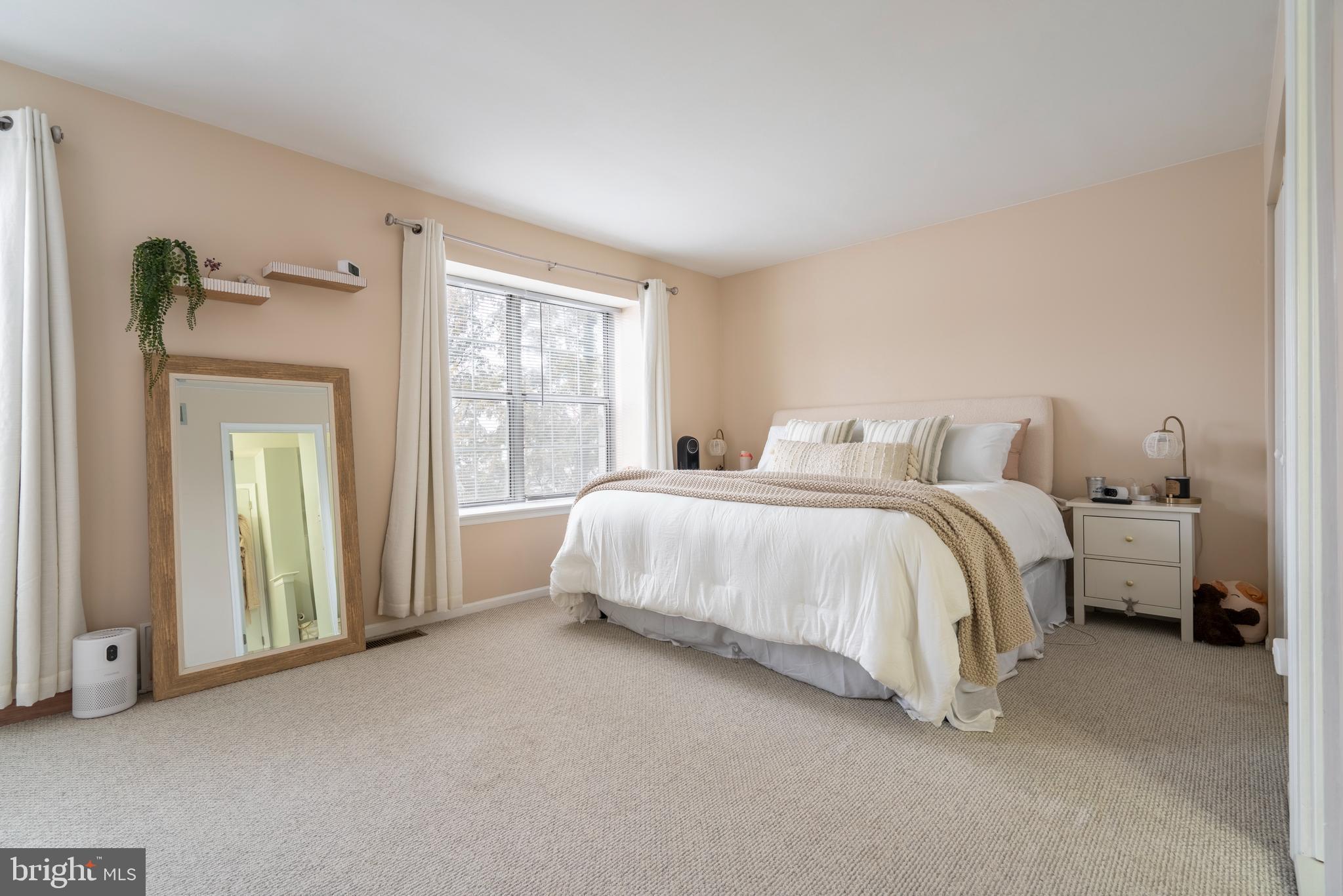 1410 Sentry Lane Eagleville, PA 19403 - Photo 23 of 32 a spacious bedroom with a bed and a large window