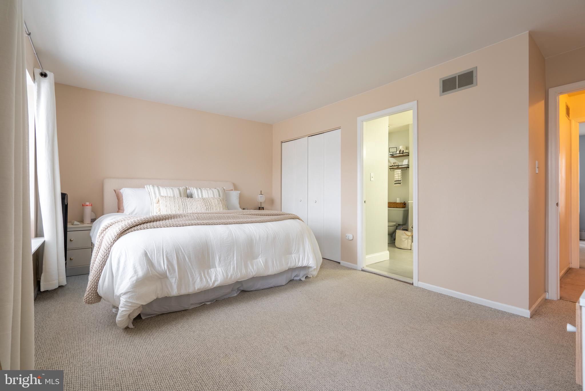 1410 Sentry Lane Eagleville, PA 19403 - Photo 24 of 32 a bedroom with a bed and a lamp