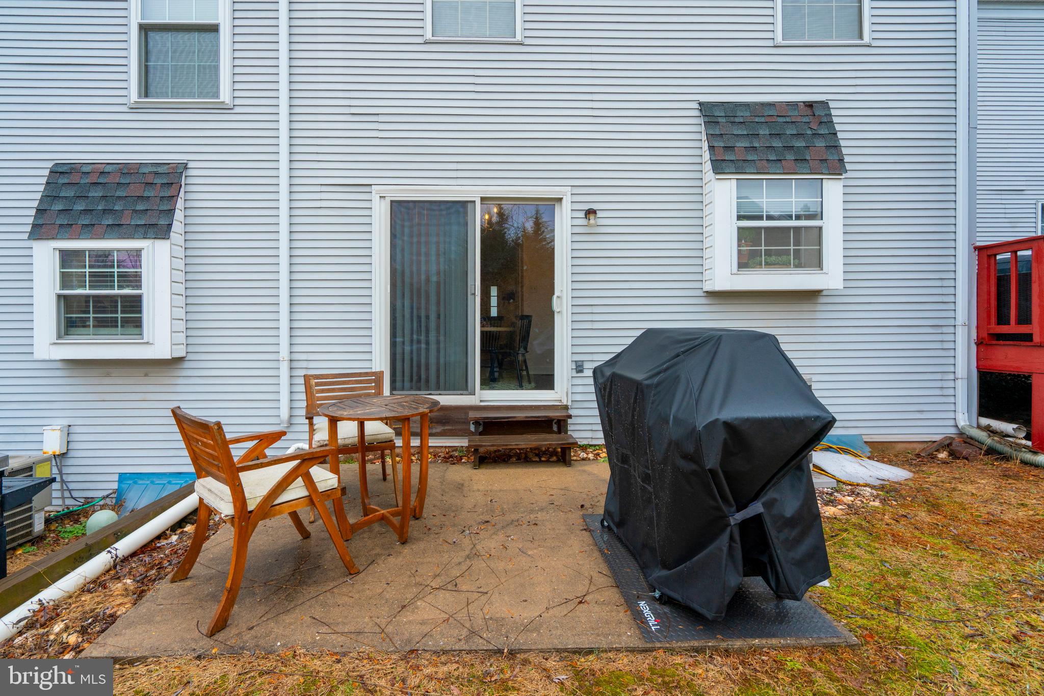 1410 Sentry Lane Eagleville, PA 19403 - Photo 30 of 32 a backyard of a house with table and chairs