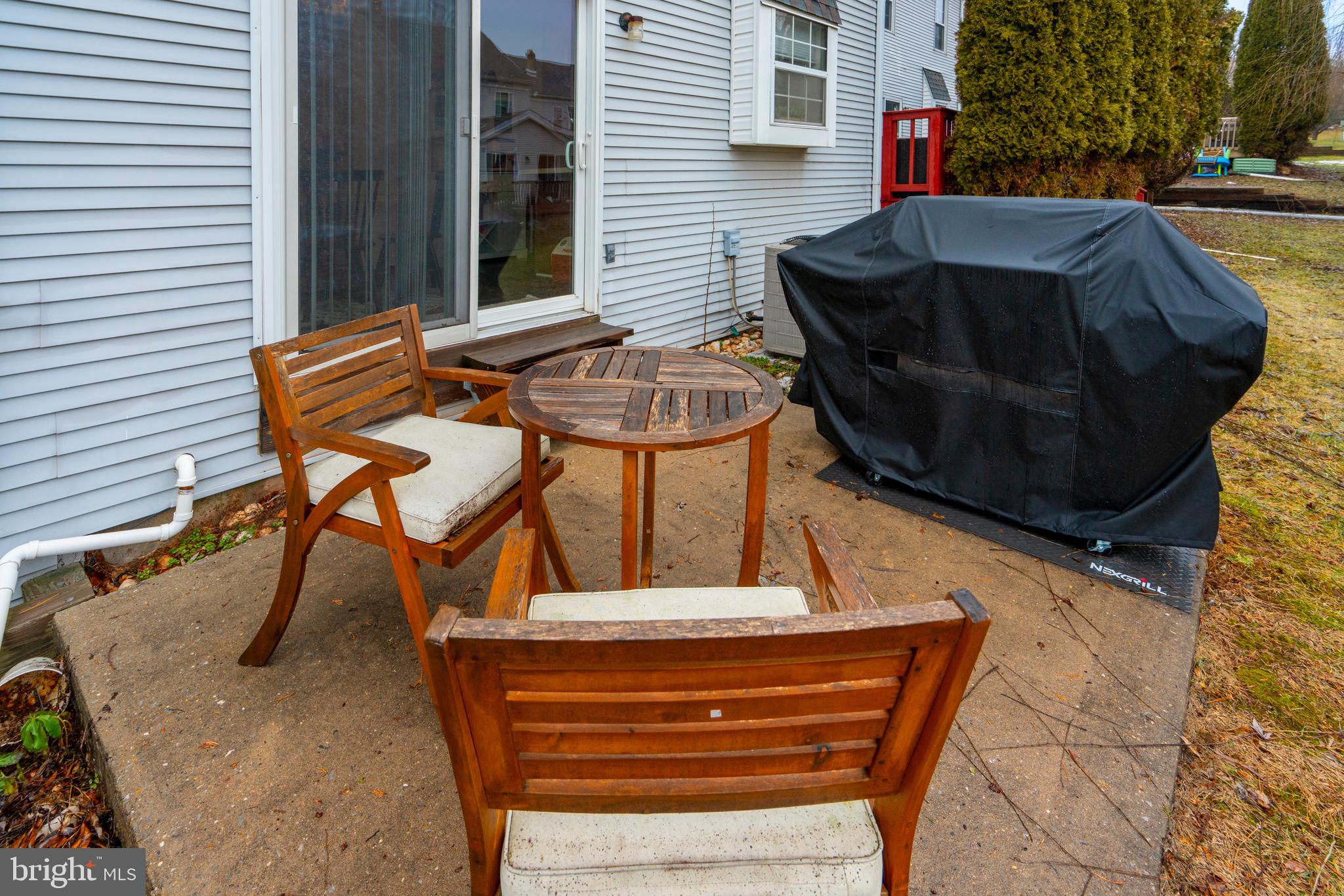 1410 Sentry Lane Eagleville, PA 19403 - Photo 31 of 32 a view of backyard with table and chairs