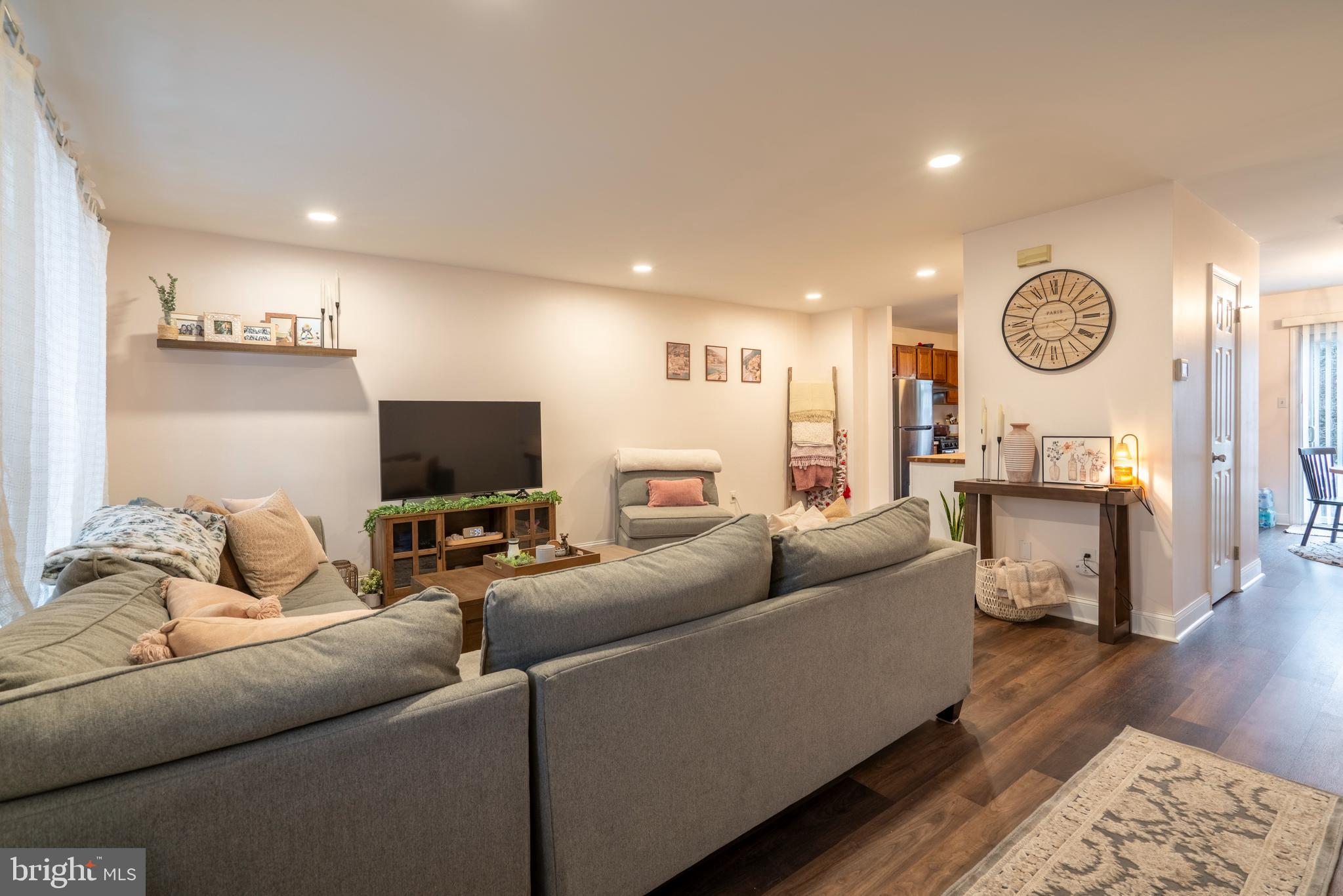 1410 Sentry Lane Eagleville, PA 19403 - Photo 5 of 32 a living room with furniture and a flat screen tv