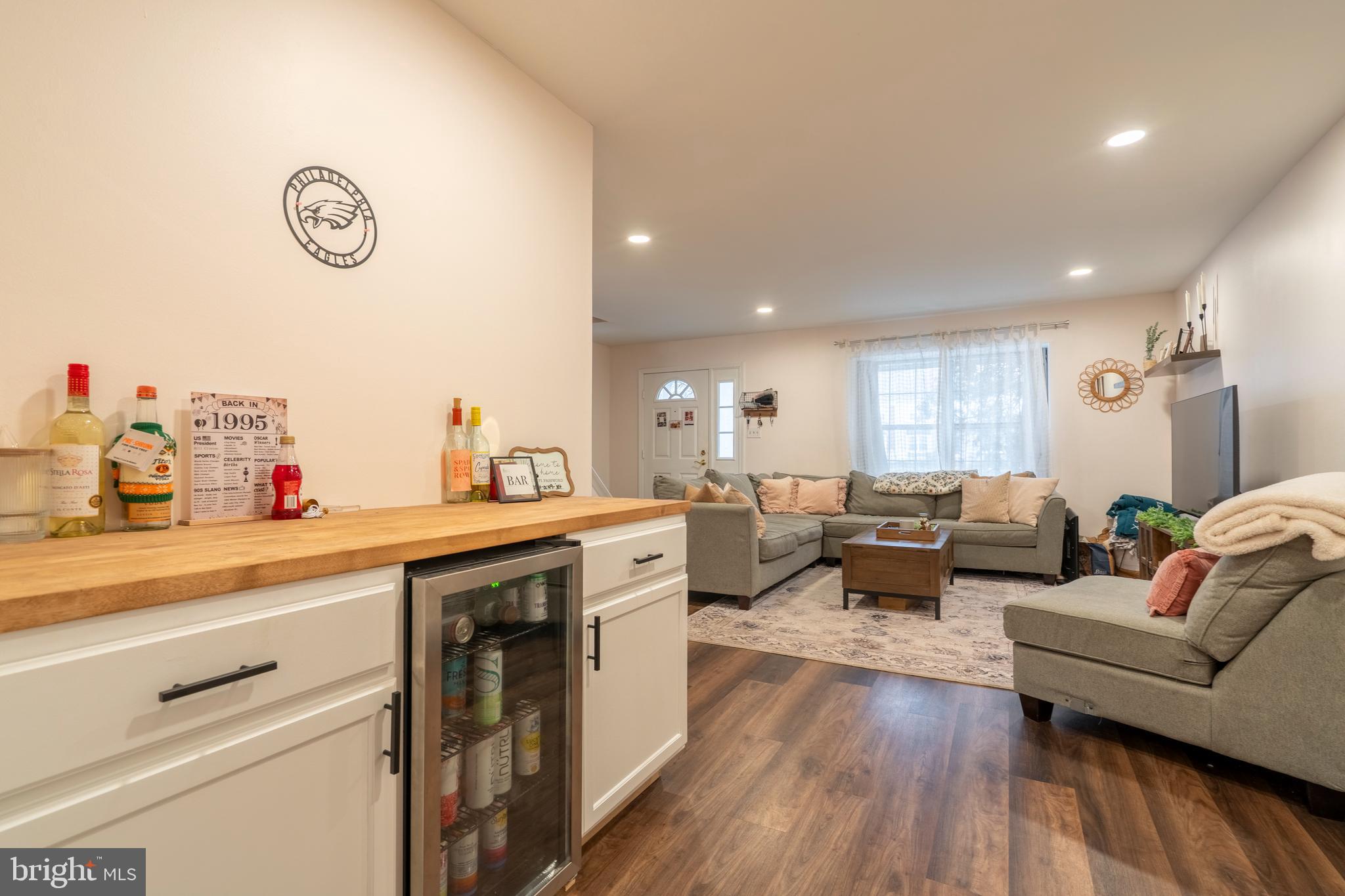 1410 Sentry Lane Eagleville, PA 19403 - Photo 9 of 32 a living room with furniture a window and wooden floor