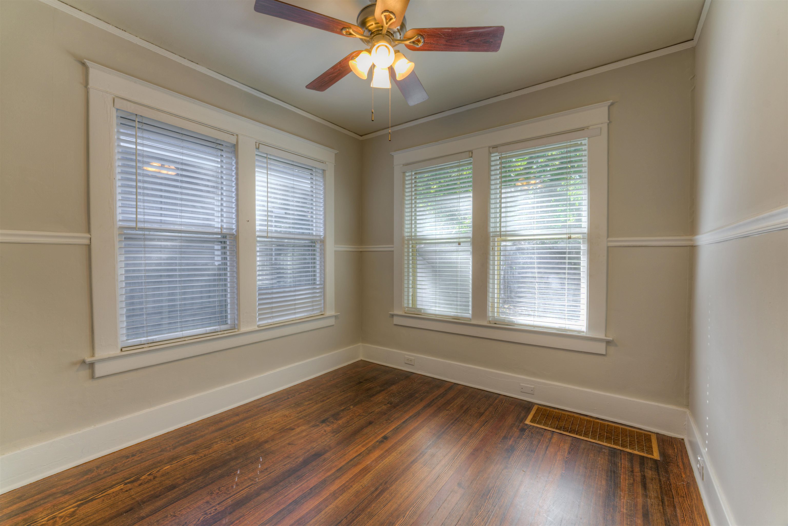 191 Lemaster Street Memphis, TN 38104 - Photo 16 of 27 Empty room with dark wood-style flooring, ceiling fan, and crown molding