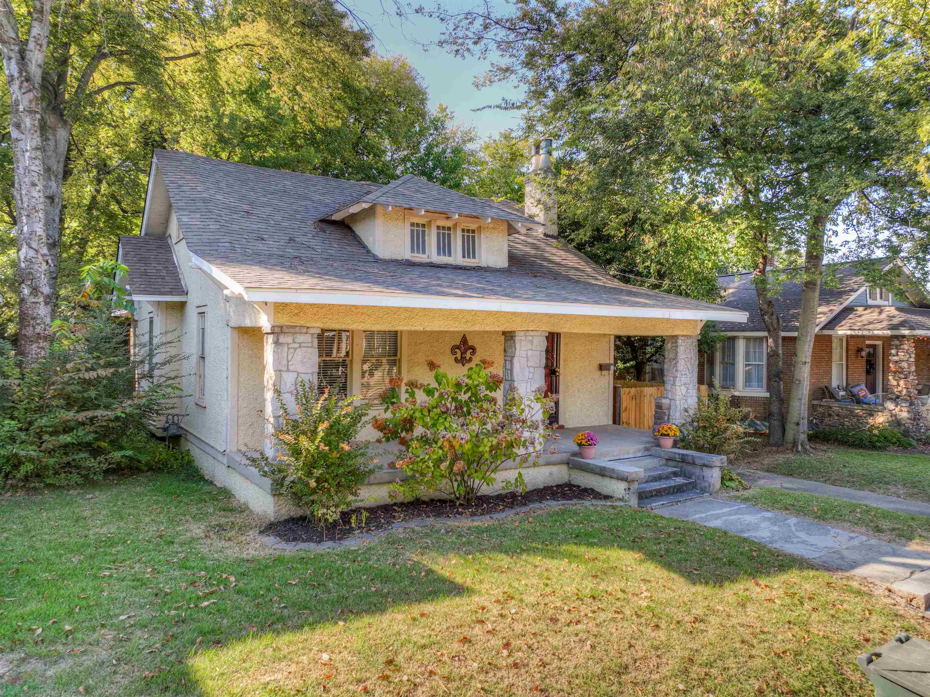 191 Lemaster Street Memphis, TN 38104 - Photo 26 of 27 Bungalow with a porch, a front lawn, a shingled roof, stucco siding, and a chimney